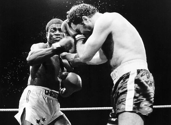 Errol Christie the Coventry middleweight punching Sean Mannion in a boxing ring