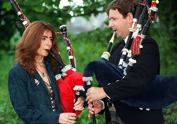 EVELYN GLENNIE Musician September 1997 WITH DIRECTOR OF PIPING RODDY MACLEOD AT THE