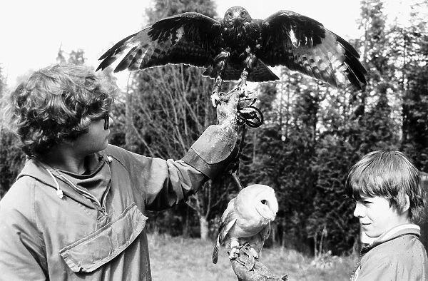 Fabian and Oliver Smith with their birds 1985 Buzzard and Barn Owl