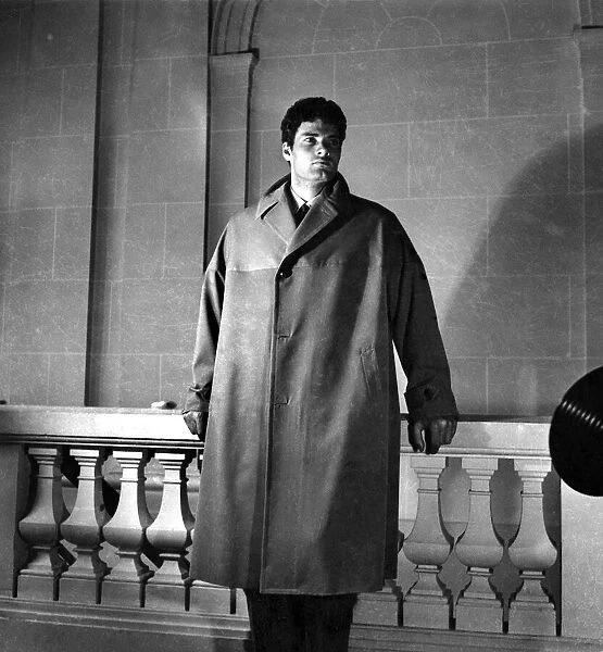 Fashion 1940 s: Male mannequin Christian Marquant wears a water-proof coat that can