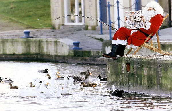 Father Christmas taking a break for the hustle and bustle of Christmas by going fishing