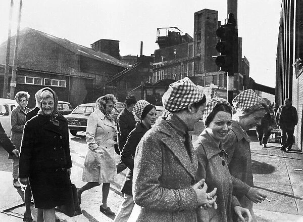 Female workers of the Tate and Lyle sugar refinery in Liverpool make their way to