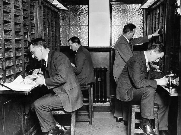 Finger Print Department. Section of search room, officers searching records