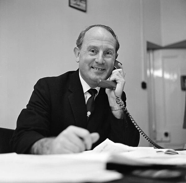 Football agent Ken Stanley reading a George Best annual. 18th February 1970