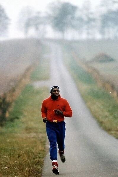 Frank Bruno jogging on a country road