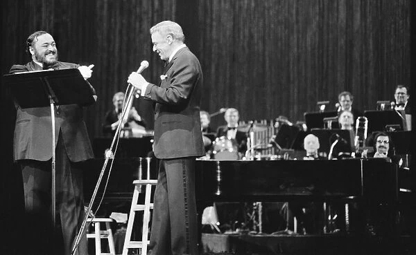 Frank Sinatra and tenor Luciano Pavarotti seen here performing on stage at Radio City in