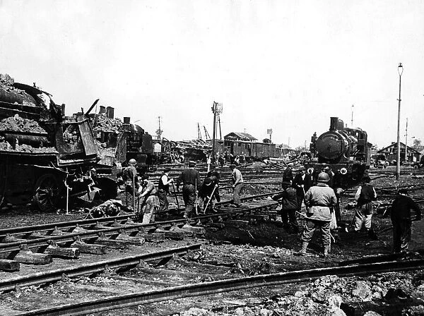 French railway workers helping American soldiers to repair track in Cherbourg 1944 WW2