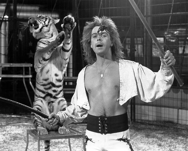 Gary Ambrose of Austen Brothers circus performing with a Bengal tiger, at Preston Park