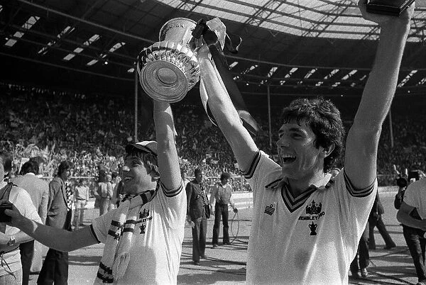 Geoff Pike and Ray Stewart of West Ham celebrate their win over Arsenal in the 1980 Cup