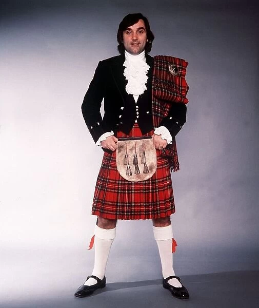 George Best football player dressed in traditional Scottish dress 1980