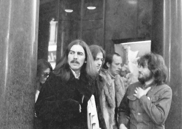 George Harrison leaves the Midland Hotel, New Street, Birmingham prior to appearing at