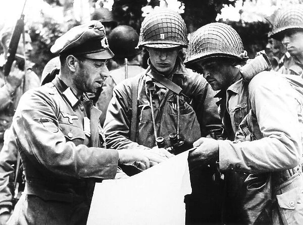 German officer (a Georgian) explaining details of a military map to US officers from