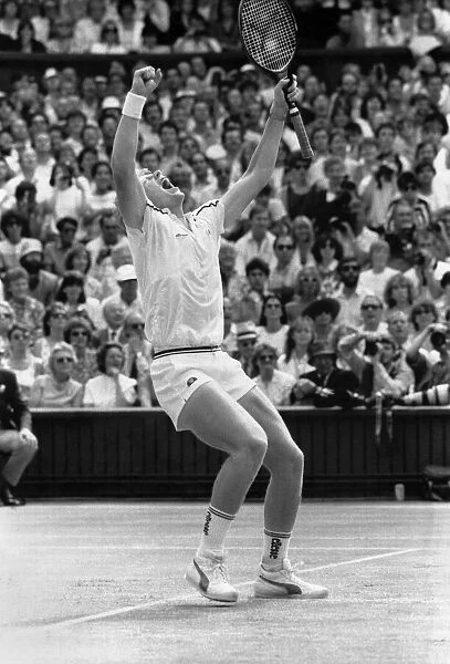 German wonder boy Boris Becker raises his arms in triumph after winning the Wimbledon