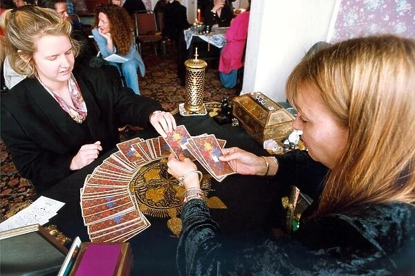 Someone getting their fortune told by tarot cards in 1994
