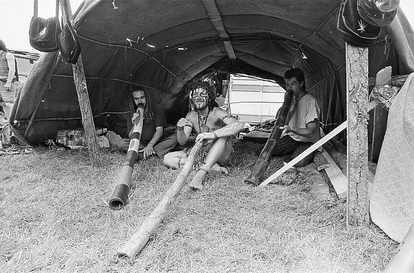 Glastonbury Festival 1994. Festival goers enjoy life with their didgeridoos