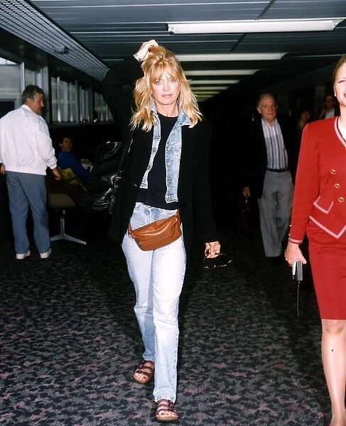 Goldie Hawn Actress walking through an Airport