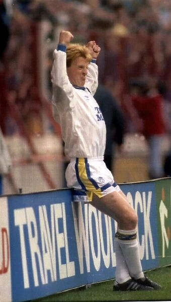 Gordon Strachan, captain of Leeds United FC, celebrates after scoring a goal in a first