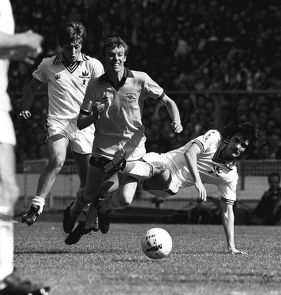 Graham Rix is brought down by Allan Devonshire of West Ham during the FA Cup Final at