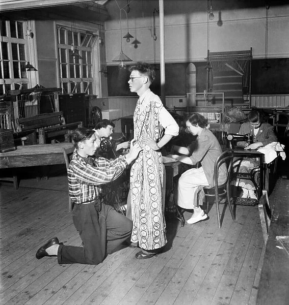 Harry Ogle (16) - Dress Designer seen here fitting his design on another student