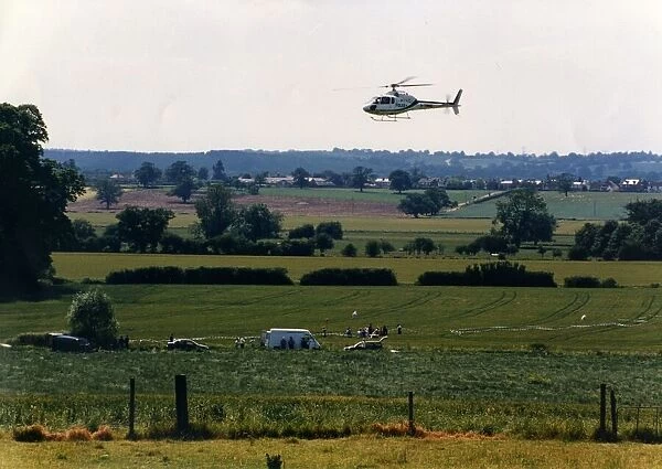 A helicoper hovers over a field at Studley Grange, Warwickshire during the making of TV
