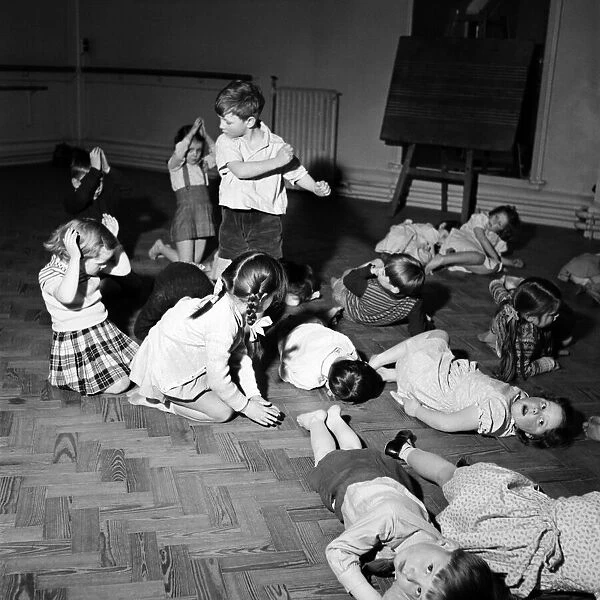 Infant schoolchildren playing during a dance and movement class. Feburary 1953 D715-004