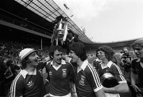 Ipswich team celebrate with the trophy after beating Arsenal in FA cup final may 1978