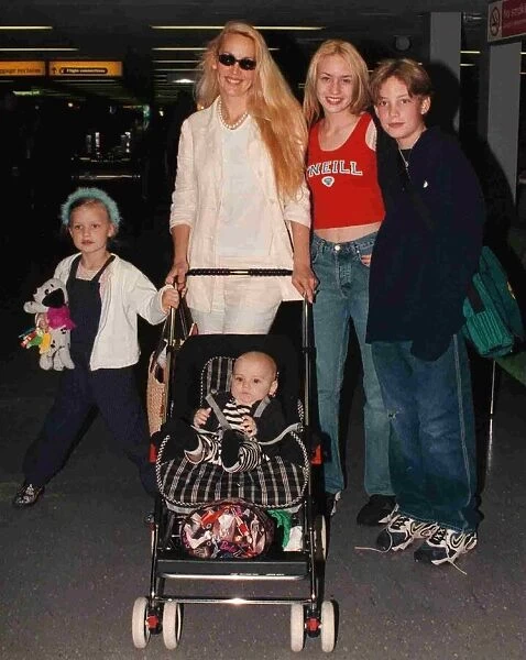 Jerry Hall and family leave Heathrow for Nice July 1998