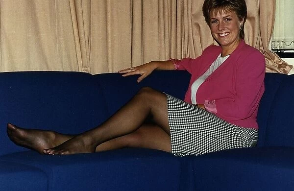 Jill Dando TV Presenter sitting with legs up on sofa on BBC Breakfast time
