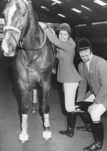 Jimmy Hill helps Angela Rippon to get onto her horse. 18th March 1978