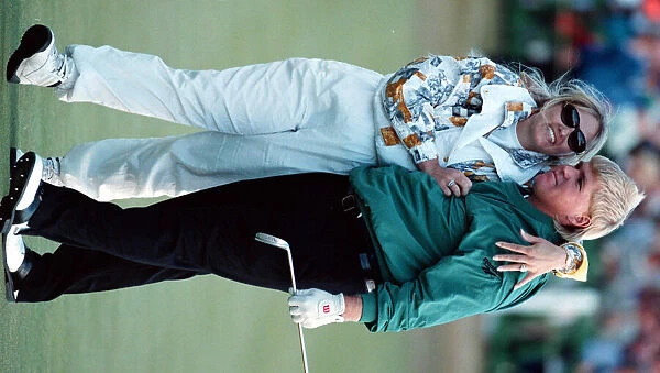 John Daly gets a hug from his wife Paulette after winning the British Open Golf