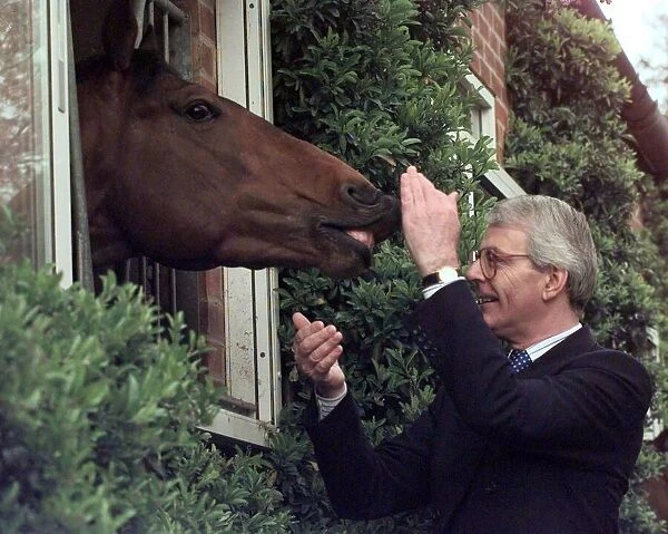 John Major gets it straight from the horses mouth during a election visit to the National