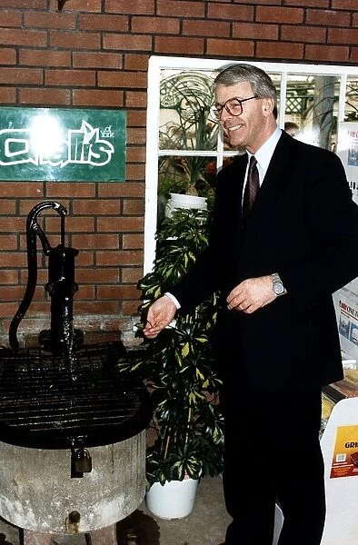 John Major Prime Minister throwing money into a wishing well during the 1992 election