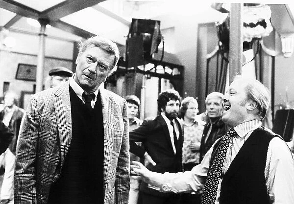 John Wayne is only joking with Richard Attenborough after a punch had been thrown in