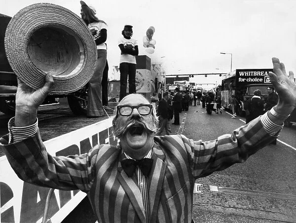 Jubilant Ray Tonken throws up a jubilant cheer as his Tom garner float moves off in