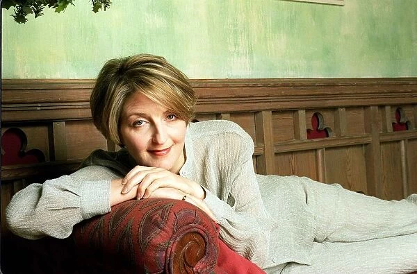Kaye Adams TV presenter at home February 1999 lying on chaise longue wearing linen suit