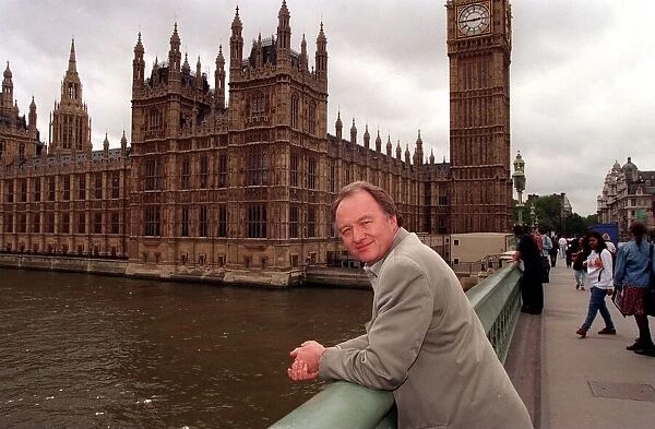 Ken Livingstone MP standing on Westminster Bridge outside the Houses of Parliament