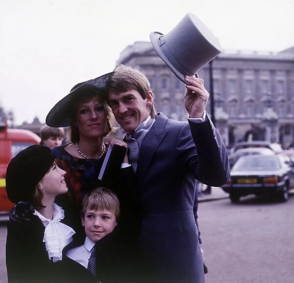 Kenny Dalglish with family in London to recieve MBE award, 1984
