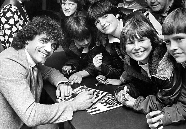 Kevin Keegan signing autographs at the opening of a furniture shop Circa 1983
