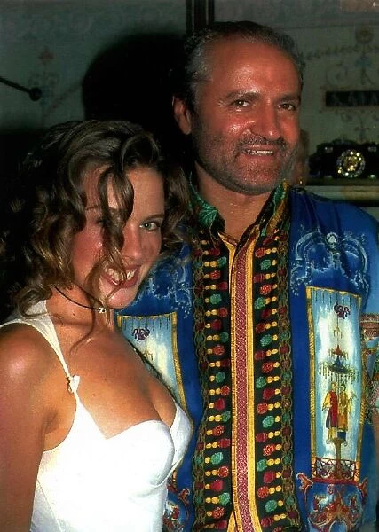 Kylie Minogue the singer and actress with designer Gianni Versace at the opening of his