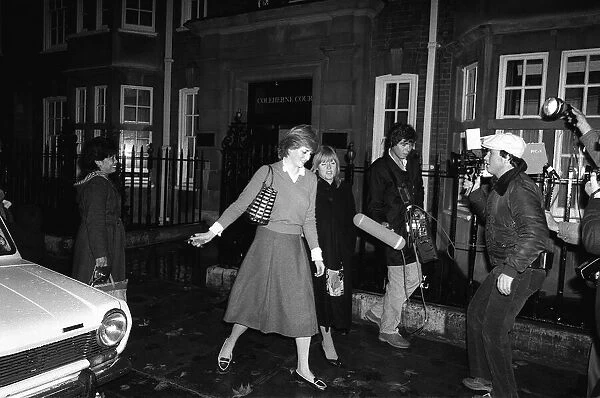 Lady Diana Spencer who is engaged to Prince Charles is hounded by the media at her flat