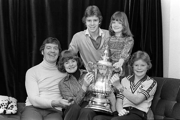 Laurie McMenemy football manager with his wife and children holding the FA Cup at