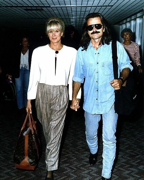 Linda Evans Actress and her friend Yanni arriving at Heathrow Airport