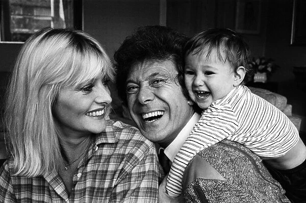 Lionel Blair pictured at home with his wife Susan and their son. 19th October 1983