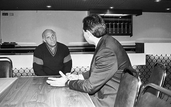 Liverpool caretaker manager Ronnie Moran gives the team news to Echo sports writer Nic