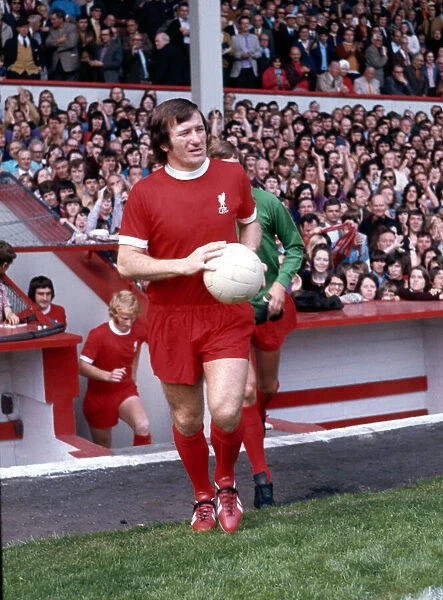 Liverpool footballer Tommy Smith waks on to the pitch before a league division one match