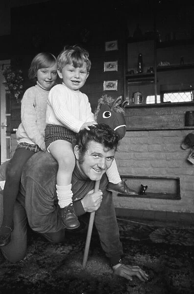 Liverpool goalkeeper Tommy Lawrence playing with his young son Stephen