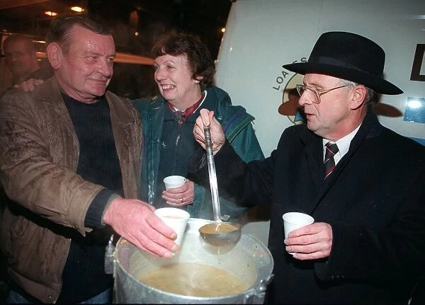 LIZ LOCKHEAD October 1997 WELCOMES A HOMELESS MAN TO HER SOUP KITCHEN AS HE TAKES