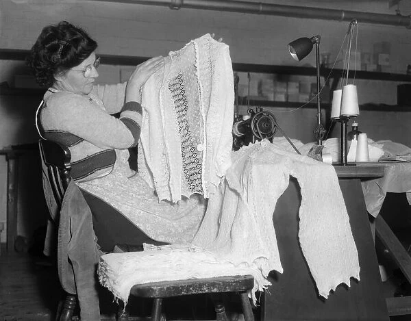 Machinist assembles a lace cardigan at The Shawl Factory of GH Hurt