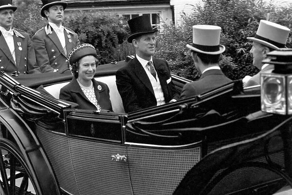 Her Majesty Queen Elizabeth II arriving at Ascot in a horse drawn carriage with her