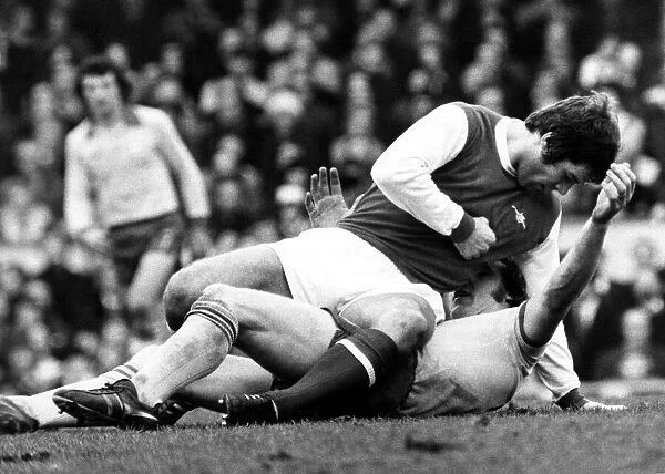 Malcolm McDonald Football Player of Arsenal - is about to punch Kevin Beattie of